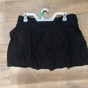 Black womens swim bottoms. Layered skirt with shorts underneath.